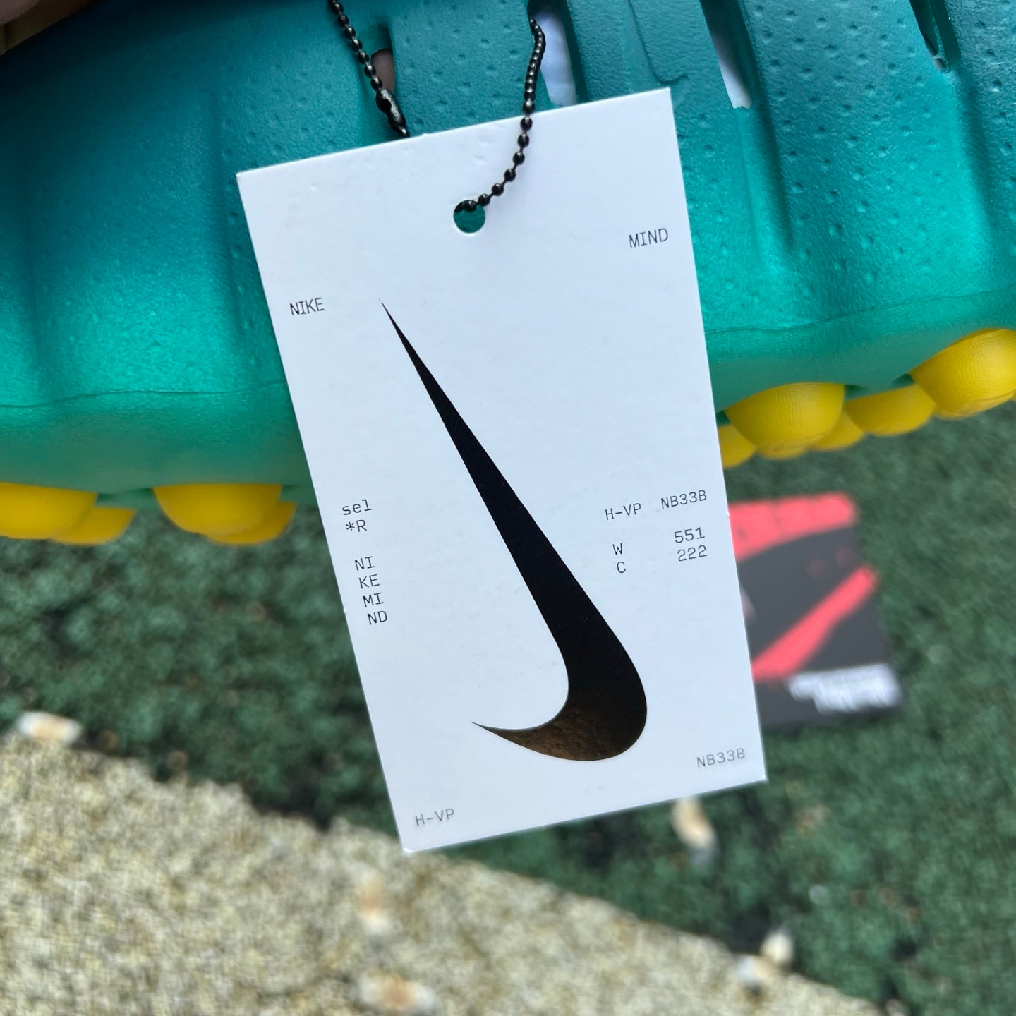 Nike Mind 001 slide in Geode Teal and Light Menta with Jordan branding, featuring a comfortable slip-on design and textured sole.