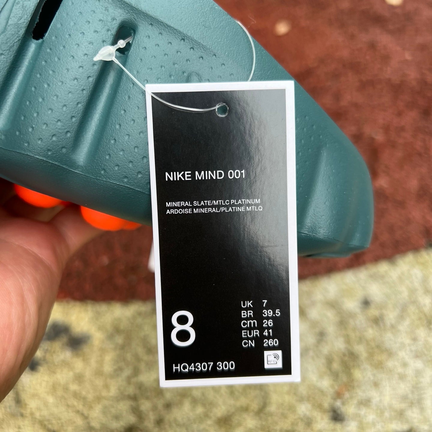 Nike x Jordan Mind 001 slide in mineral slate color, featuring a comfortable slip-on design with Nike and Jordan branding.