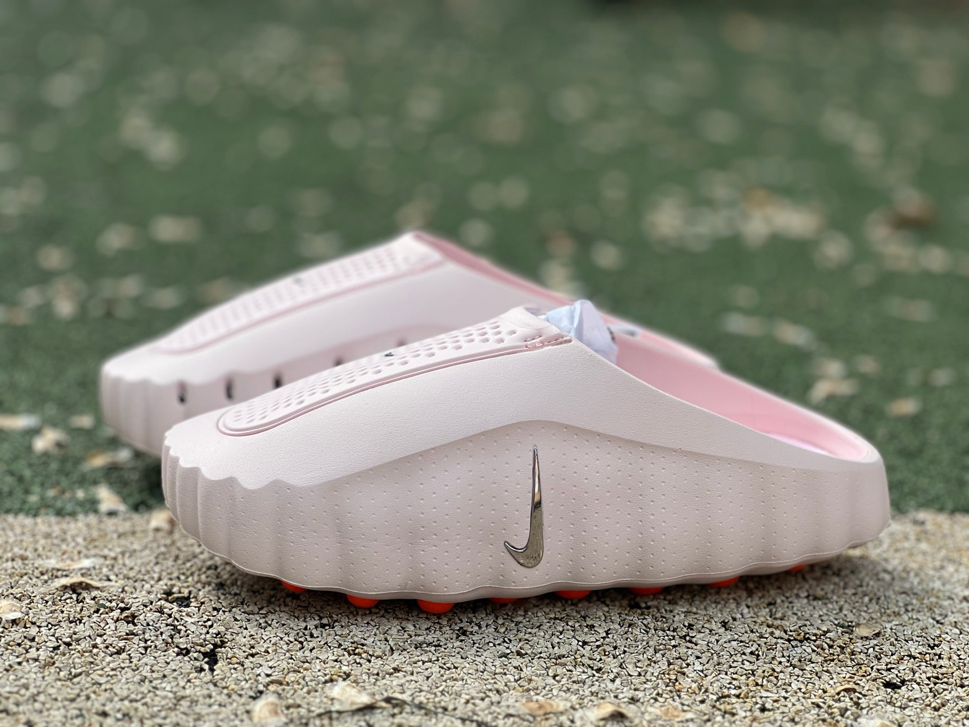 Nike x Jordan Mind 001 Slide in Pearl Pink with Nike branding, featuring a comfortable slip-on design and cushioned sole.