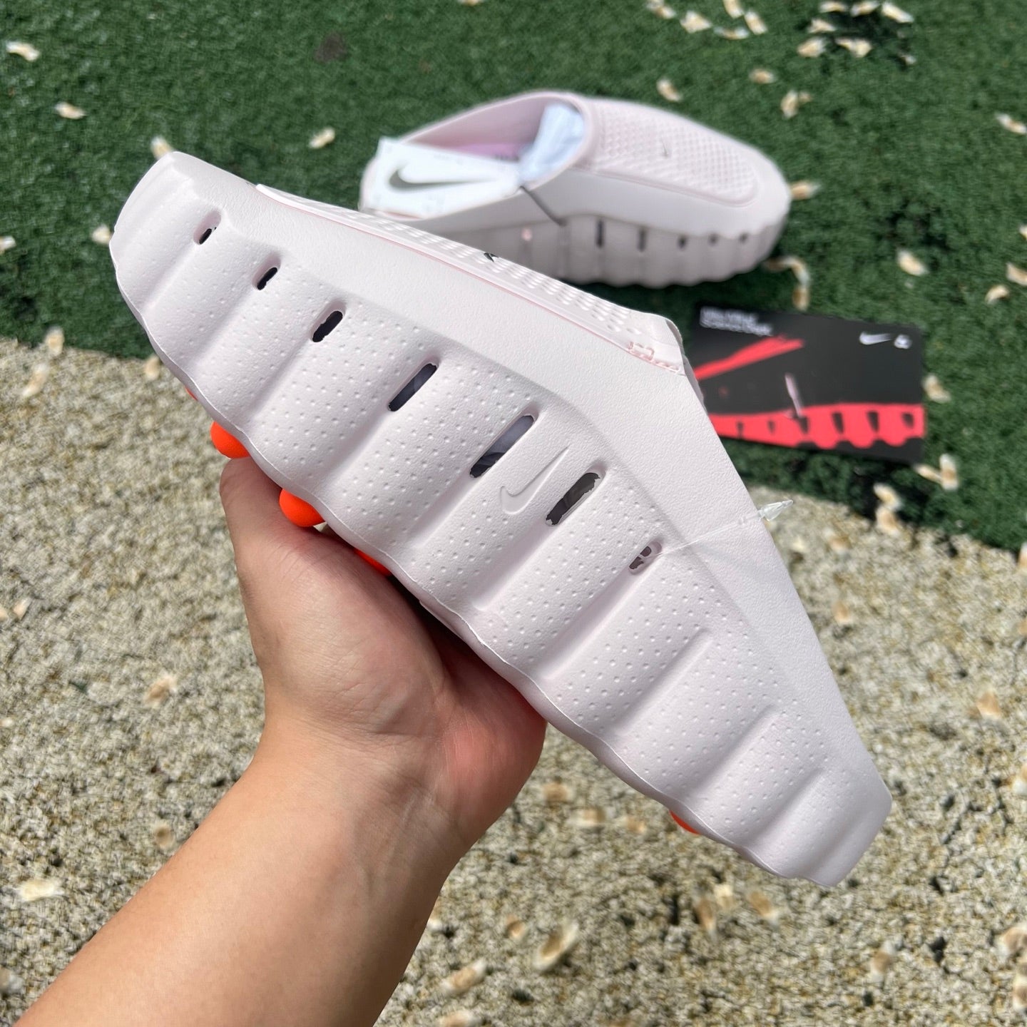 Pink Nike Mind 001 Slide from Nike x Jordan collection, featuring pearl pink straps and casual slide sandal design.