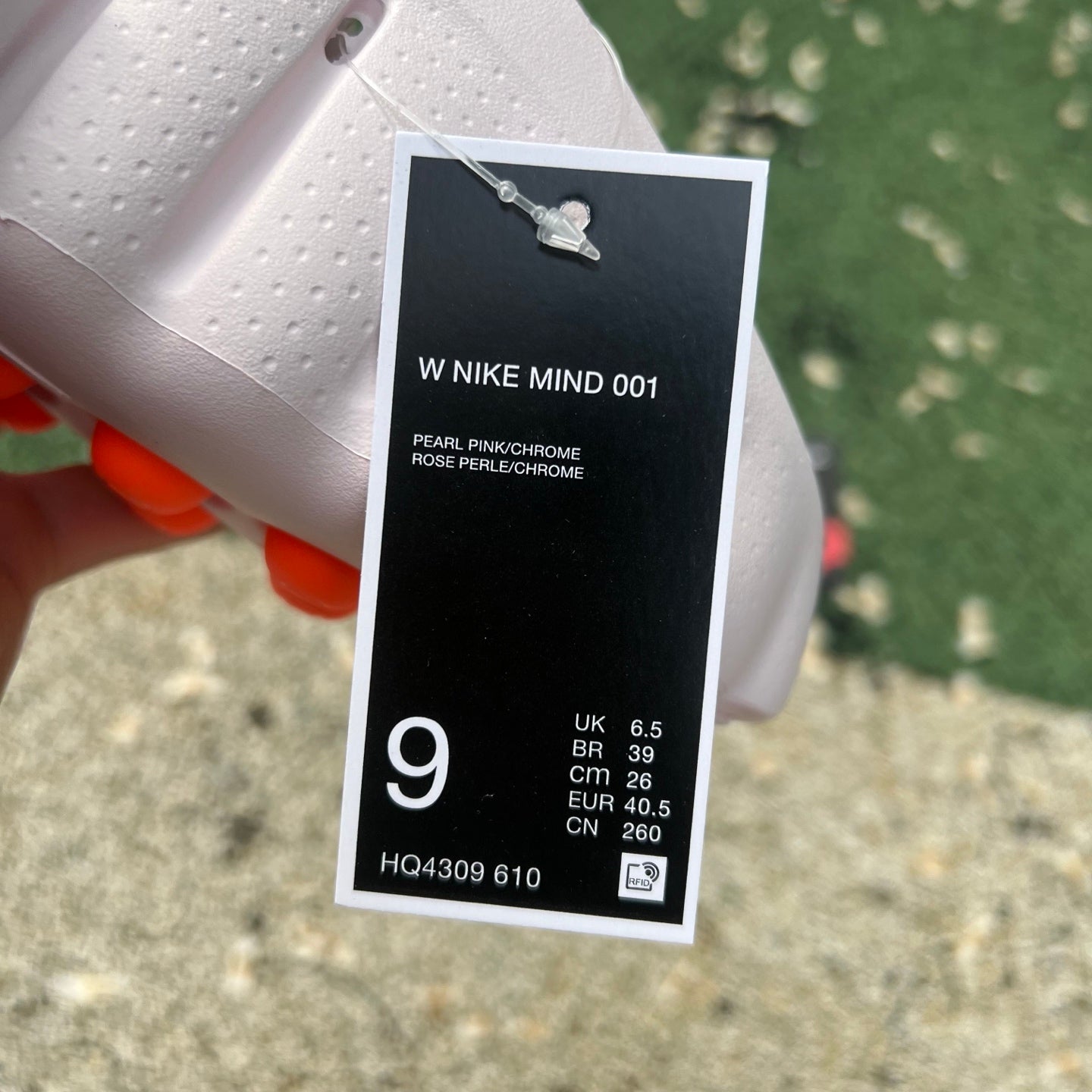 Nike x Jordan Mind 001 Pearl Pink slide sandal with Nike branding, featuring a soft pink color and comfortable design.
