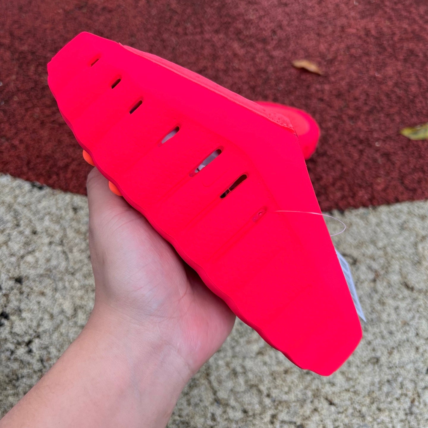 Nike x Jordan Mind 001 Slide in Solar Red with black strap, featuring Nike and Jordan branding and cushioned sole.