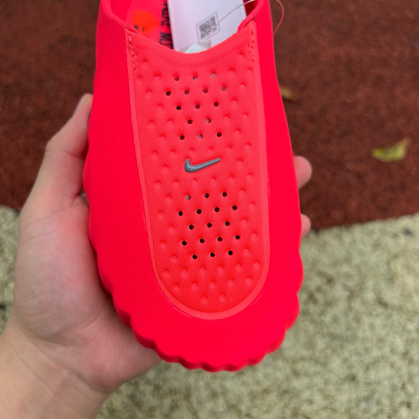 Nike Jordan Mind 001 Slide in Solar Red with cushioned sole and adjustable strap, designed for comfort and sporty style.
