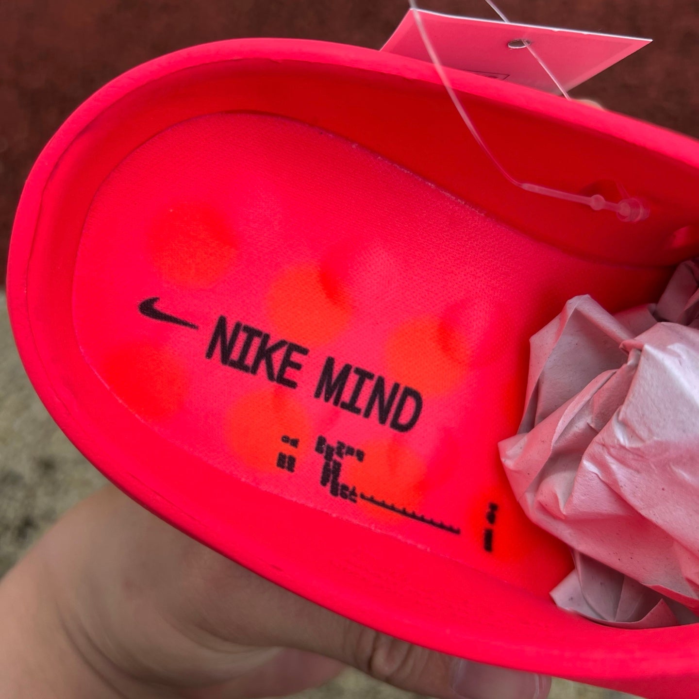 Nike x Jordan Mind 001 Slide in Solar Red with cushioned black strap and sporty design, perfect for casual wear.