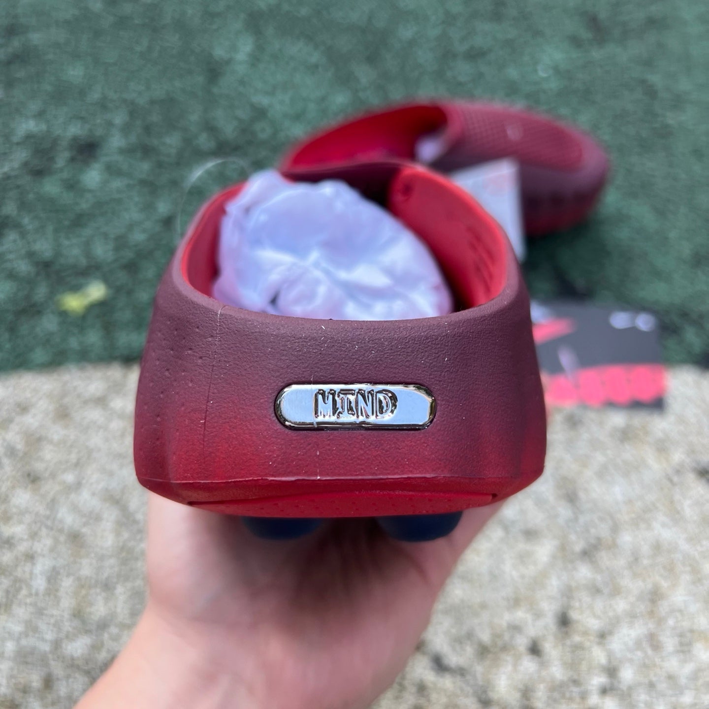 Nike x Jordan Mind 001 slide in team red and university red with Nike branding, displayed on a plain background.