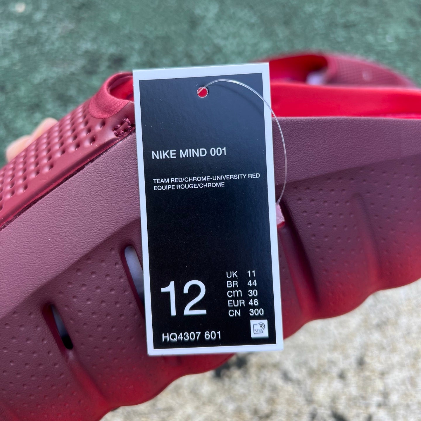 Nike Mind 001 Slide in team red and university red with Nike x Jordan branding, featuring a cushioned slide design.