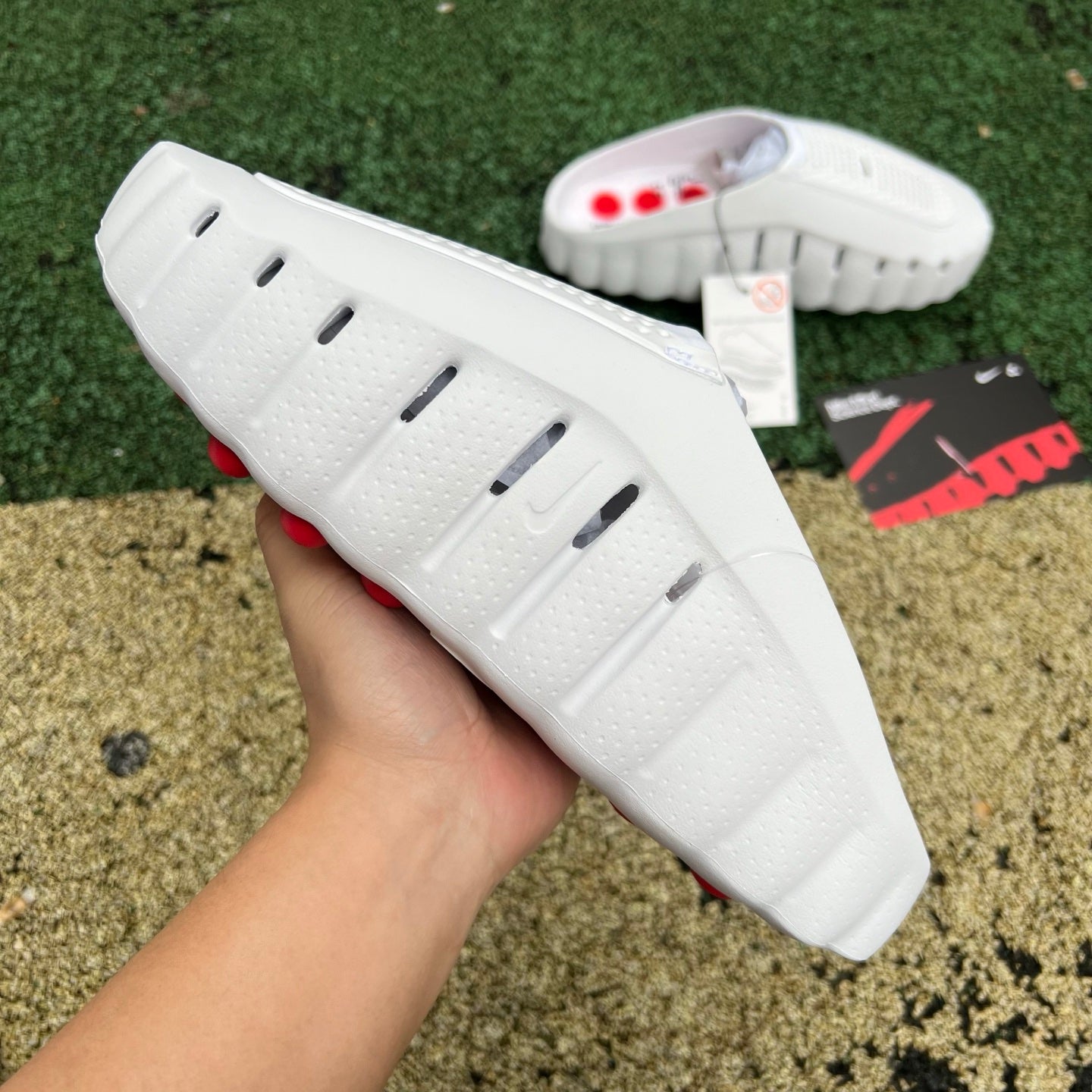 Nike x Jordan Mind 001 white and red slide sandal with Speed Red accents, featuring Nike branding and casual slip-on design.