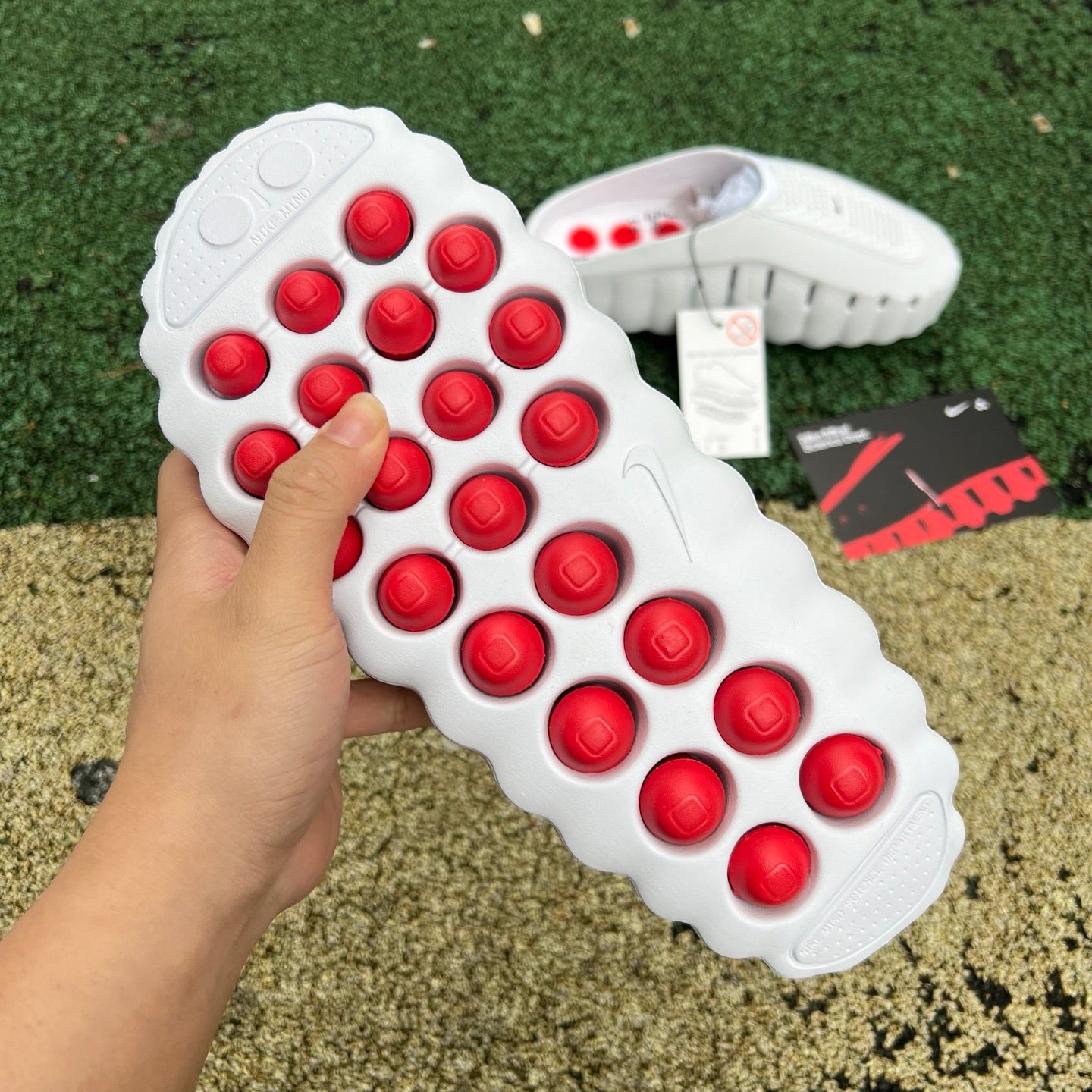 Nike x Jordan Mind 001 Slide in white with red accents, featuring a sporty slide design and branded logo details.
