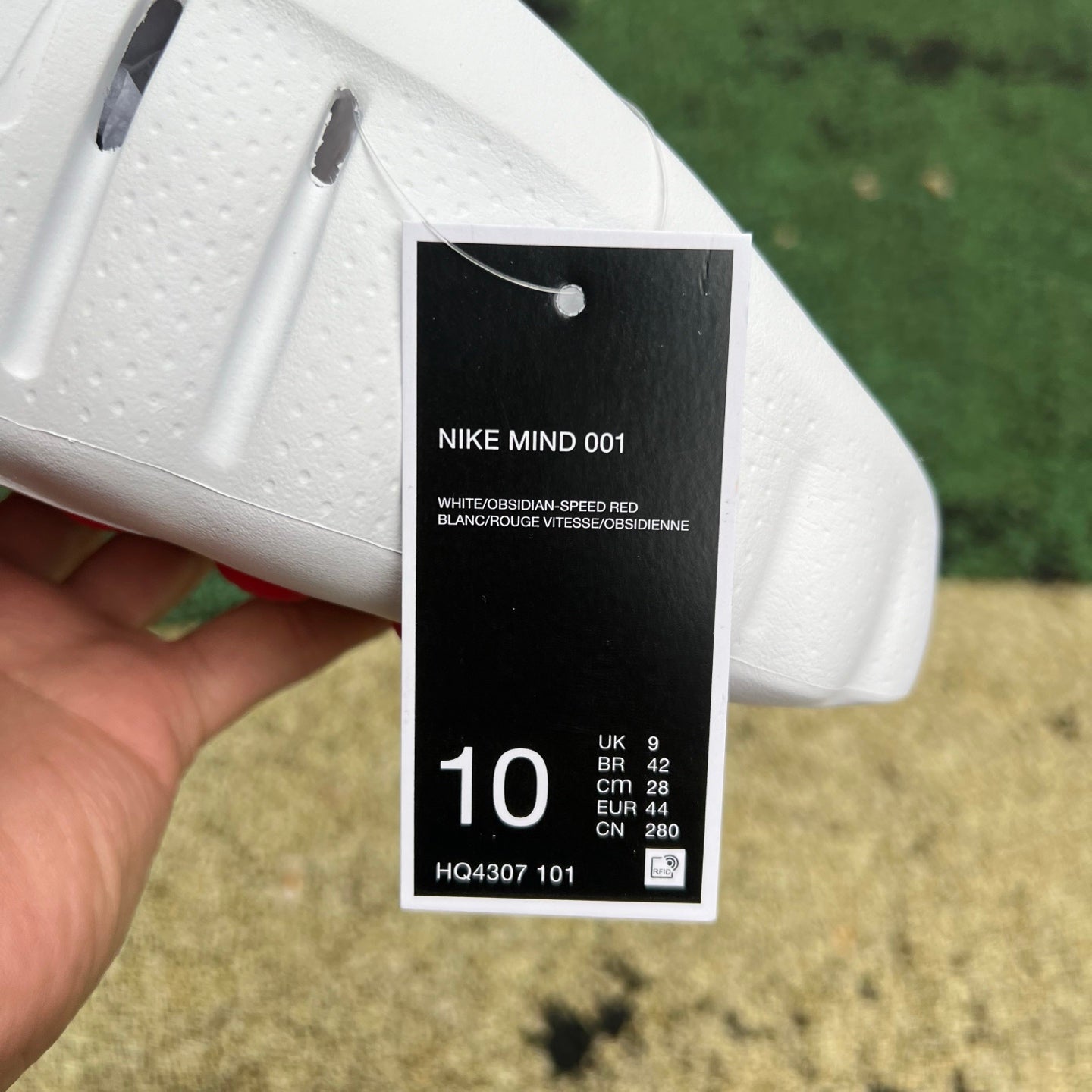 Nike x Jordan Mind 001 slide in white with red accents, featuring a comfortable strap and sporty design.