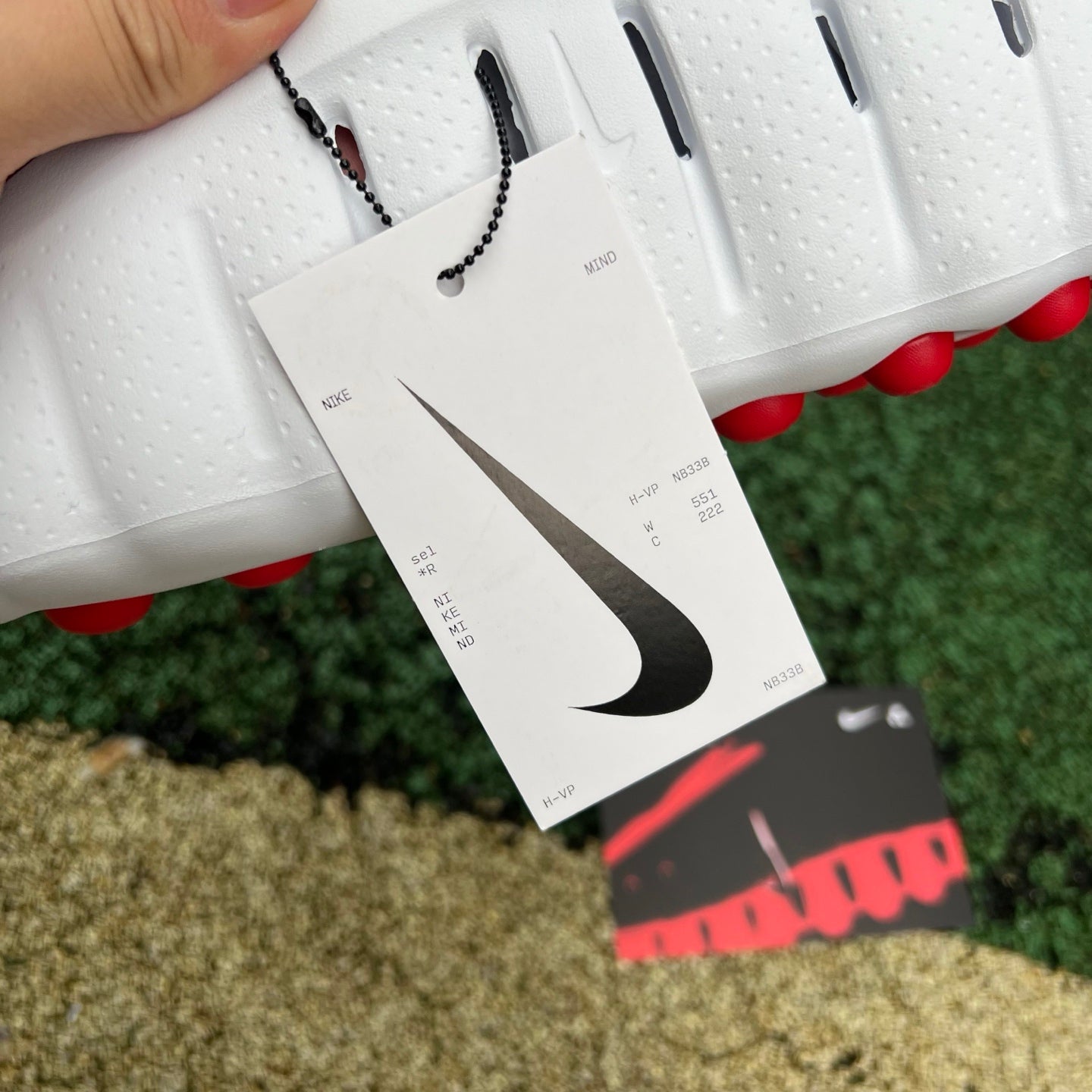 Nike x Jordan Mind 001 slide in white with red accents, featuring a comfortable slip-on design and sporty style.
