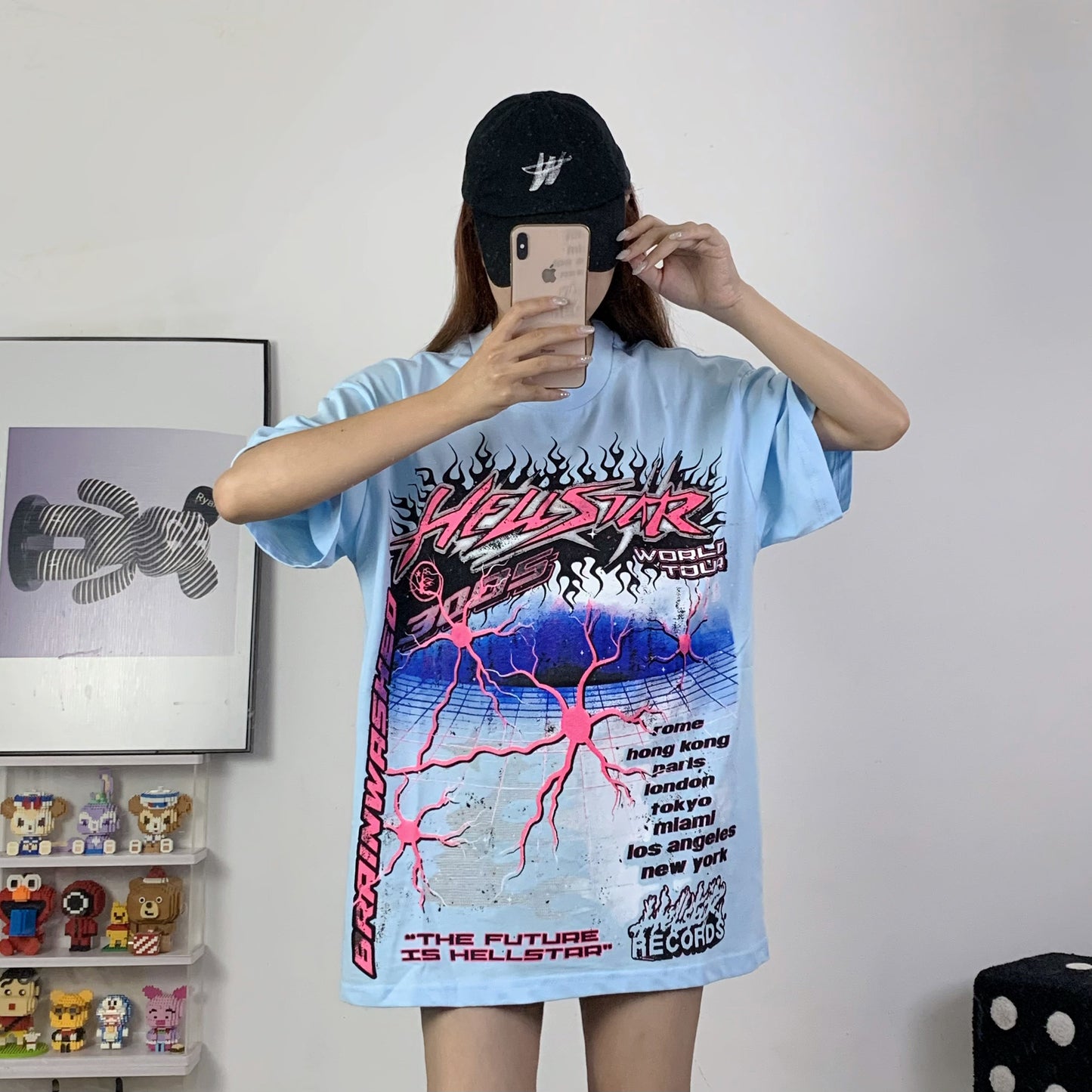 Black SneakerX.im T-Shirt 033 displayed on a wooden surface, featuring a crew neck and short sleeves.
