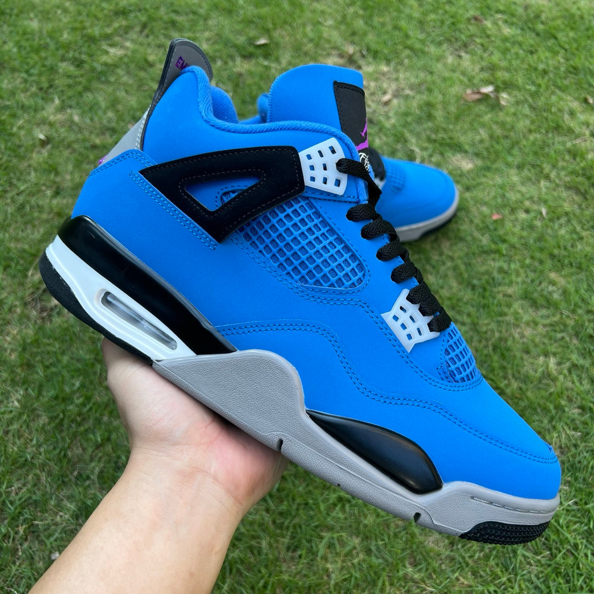 Nike x Jordan Air Jordan 4 Retro Eminem Encore sneakers in black and red with signature design details.