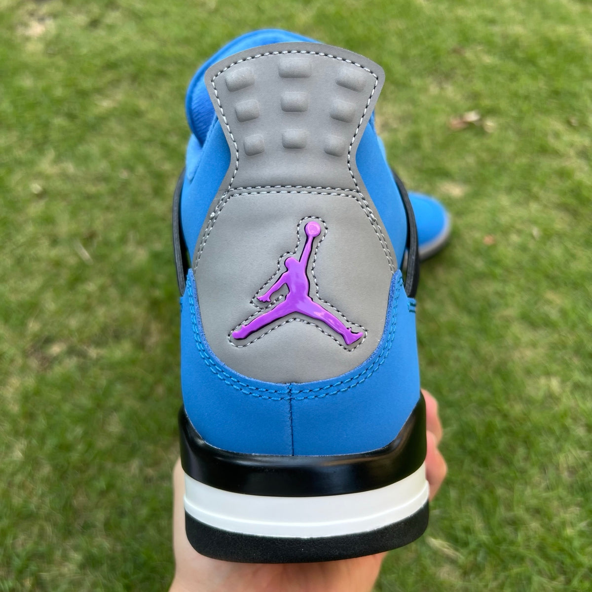 Nike x Jordan Air Jordan 4 Retro Eminem Encore sneakers in black and white with signature design details.