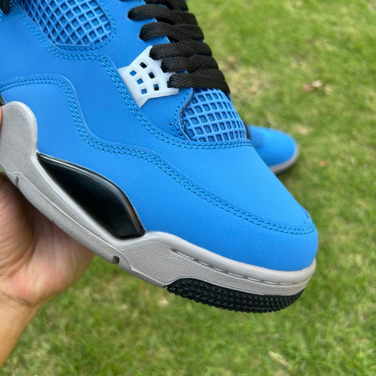 Nike x Jordan Air Jordan 4 Retro Eminem Encore sneakers, front view showing black and red colorway and signature design details.