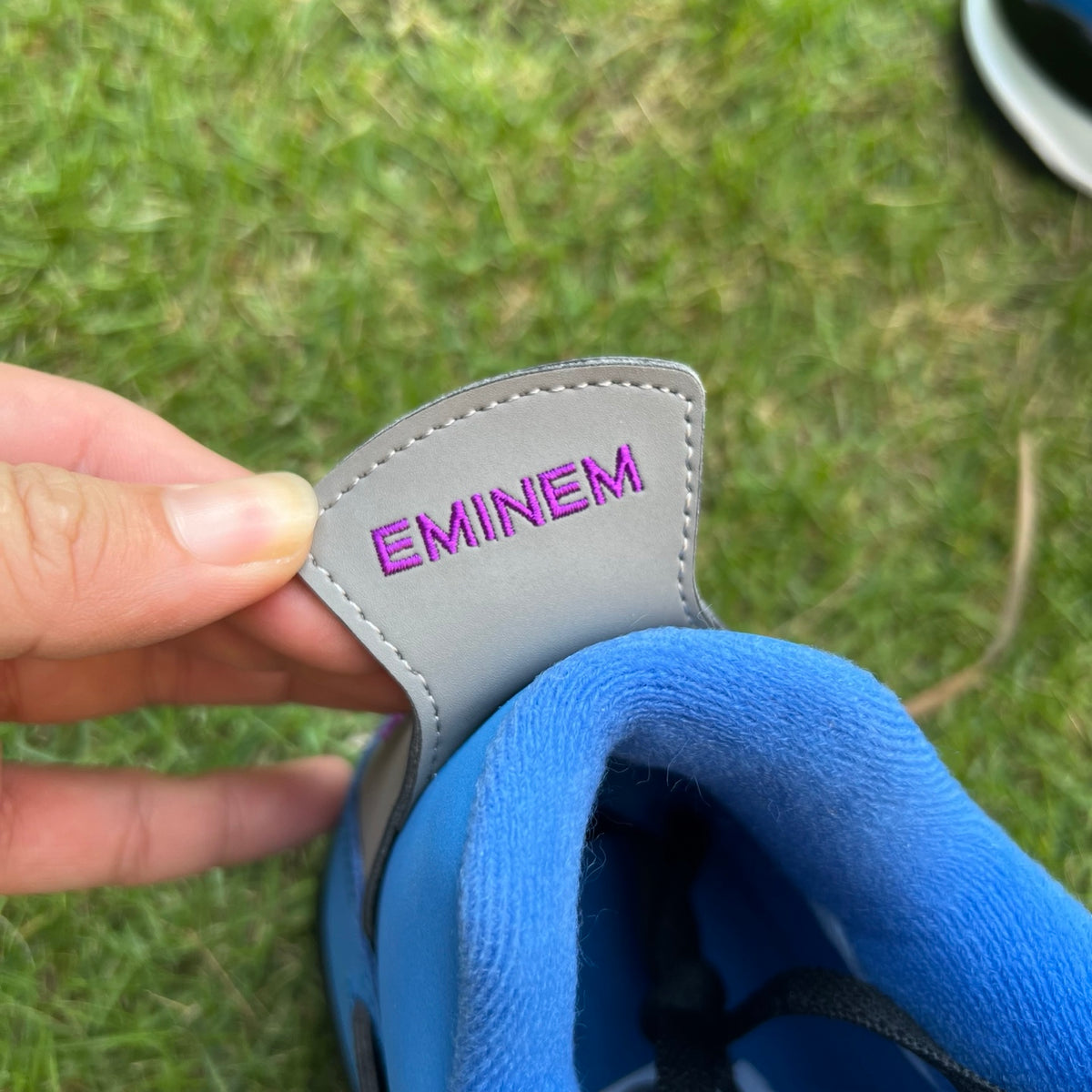 Nike x Jordan Air Jordan 4 Retro Eminem Encore sneakers with black and gray colorway, featuring signature design details.