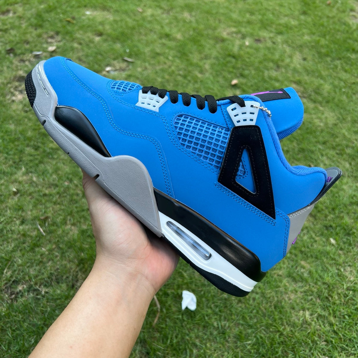 Nike x Jordan Air Jordan 4 Retro Eminem Encore sneakers in black and red with signature design details.