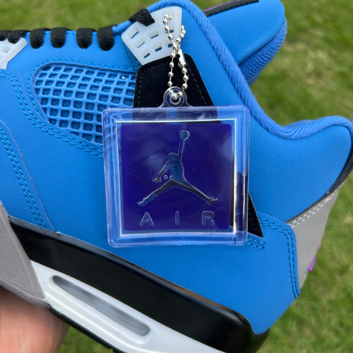 Nike Jordan Air Jordan 4 Retro Eminem Encore sneakers in black and gray with signature design details.