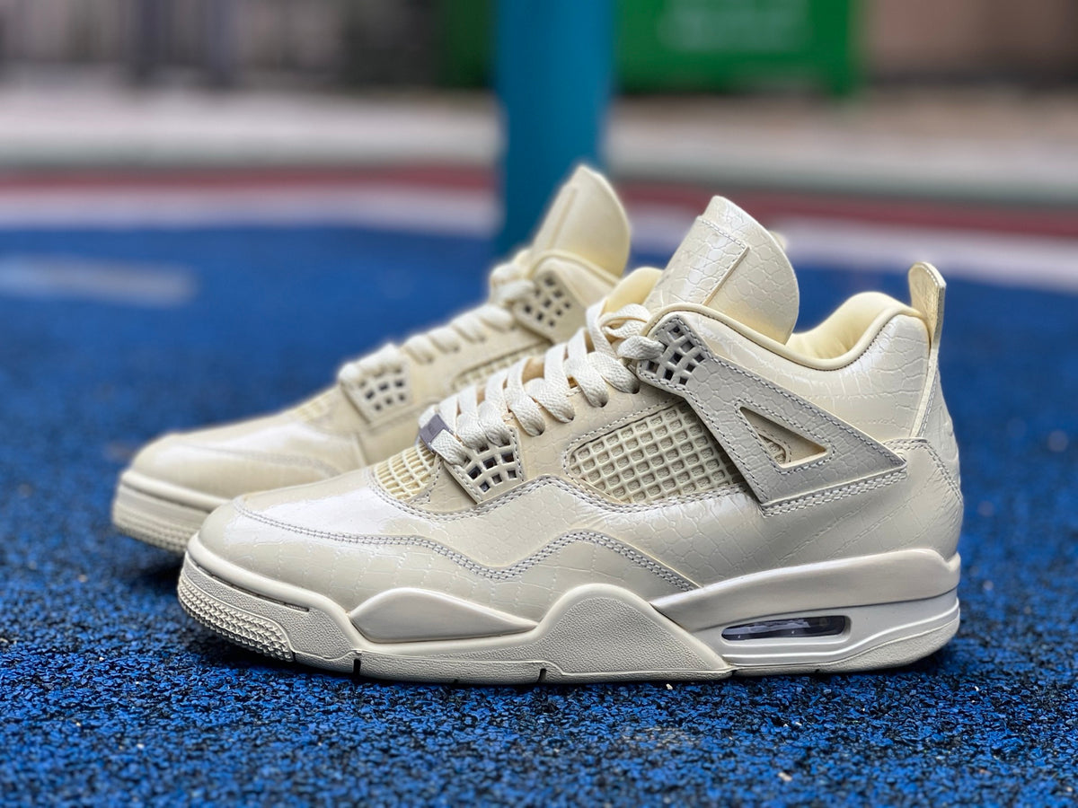 Nike Air Jordan 4 Retro J Balvin Lemonade sneakers featuring vibrant yellow and black colorway and signature Jordan design.