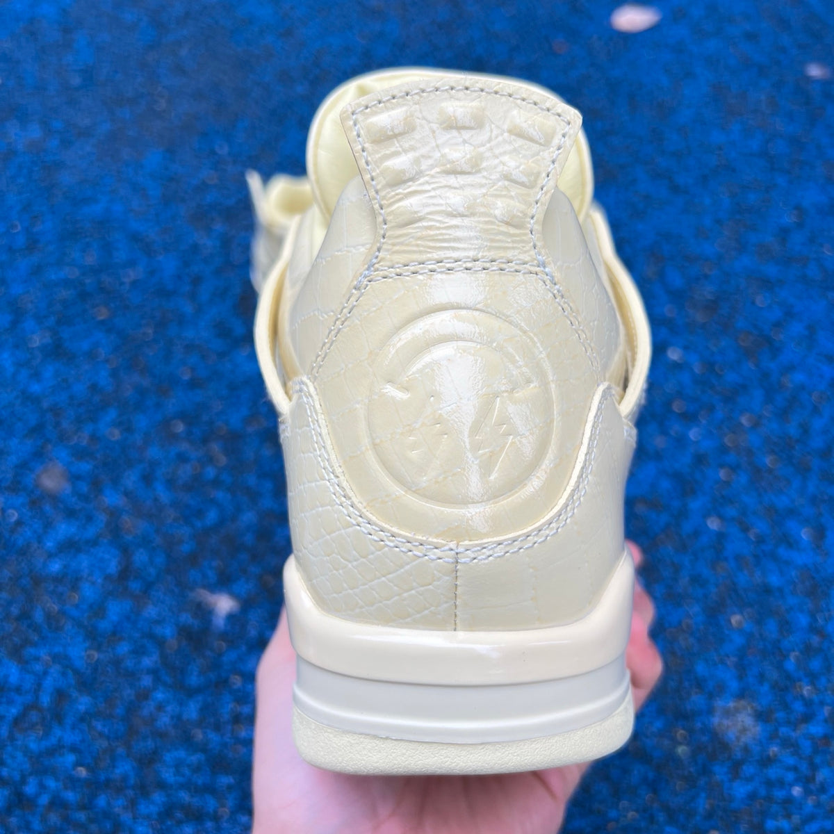 Nike Jordan Air Jordan 4 Retro J Balvin Lemonade sneakers in yellow and black with detailed design and Nike branding.