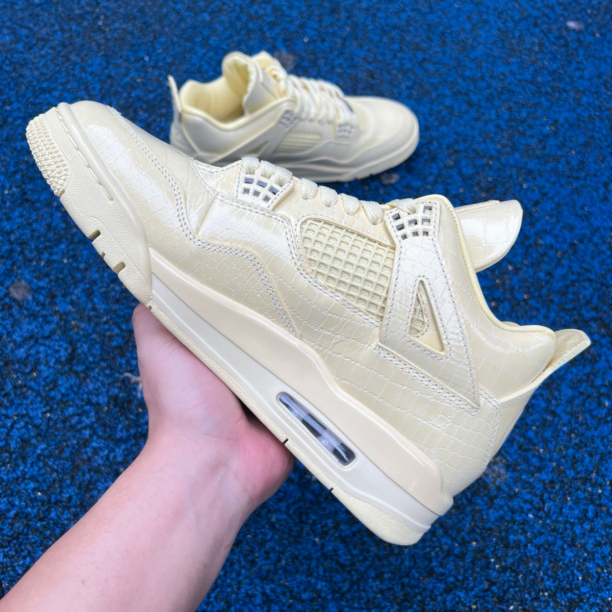 Nike Jordan Air Jordan 4 Retro J Balvin Lemonade sneakers showing the colorful design and distinctive silhouette on a plain background.