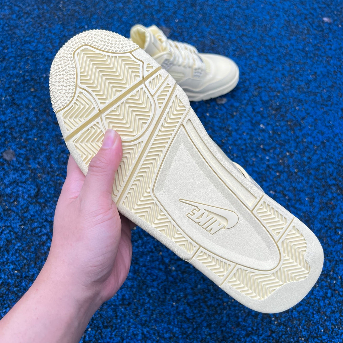 Nike Air Jordan 4 Retro J Balvin Lemonade sneakers featuring yellow and black colorway, classic basketball shoe design.