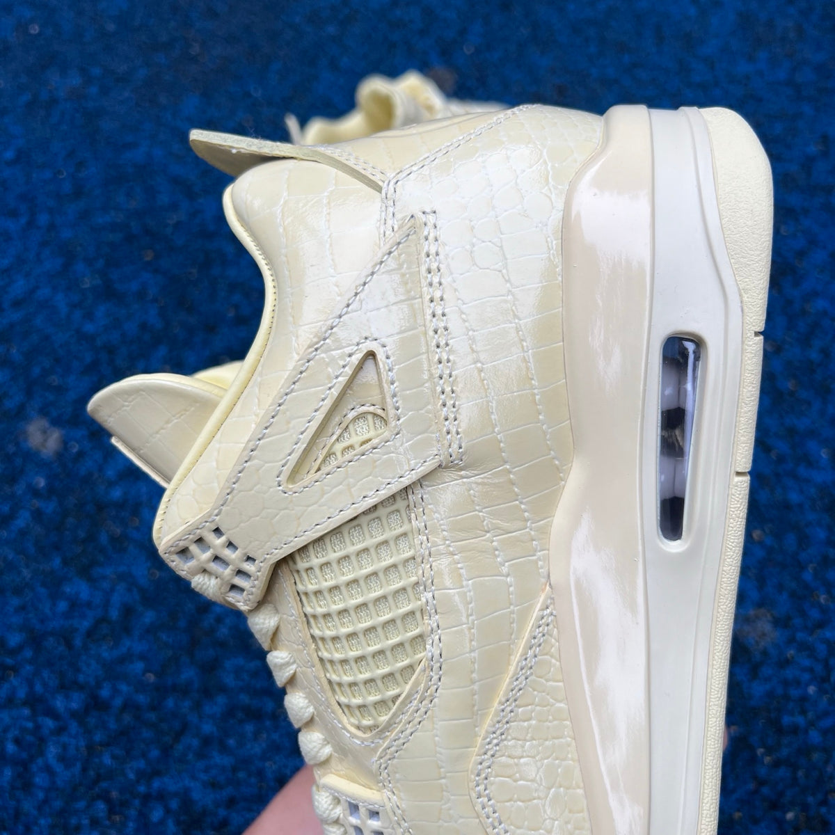 Nike Air Jordan 4 Retro J Balvin Lemonade sneakers, featuring vibrant yellow and white colorway with stylish design details.