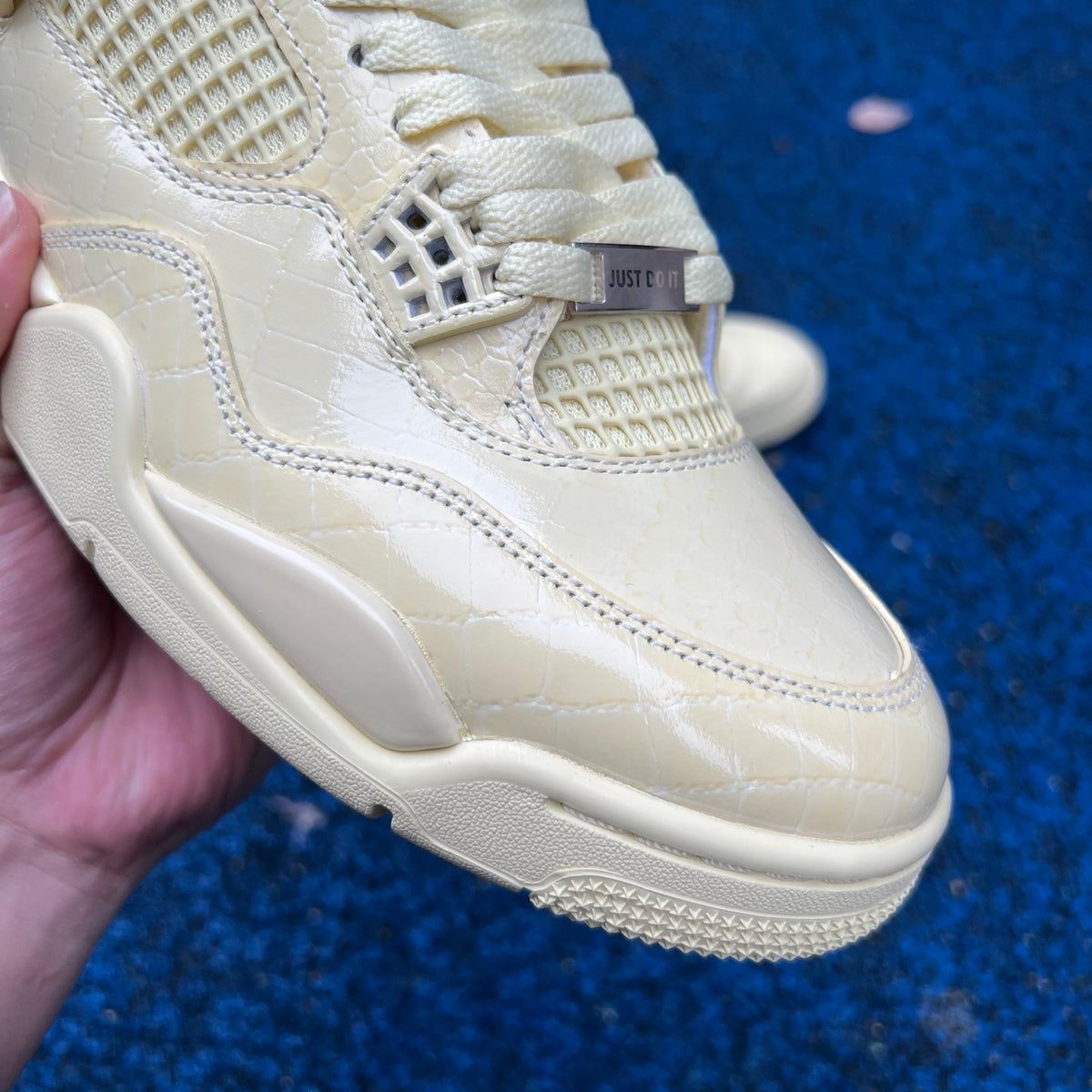 Nike Air Jordan 4 Retro J Balvin Lemonade sneakers in yellow and black with stylish design details.