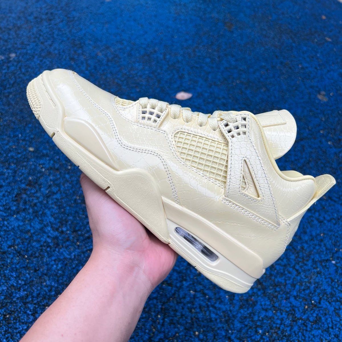 Nike Air Jordan 4 Retro J Balvin Lemonade sneakers featuring yellow and black colorway, with signature design details.
