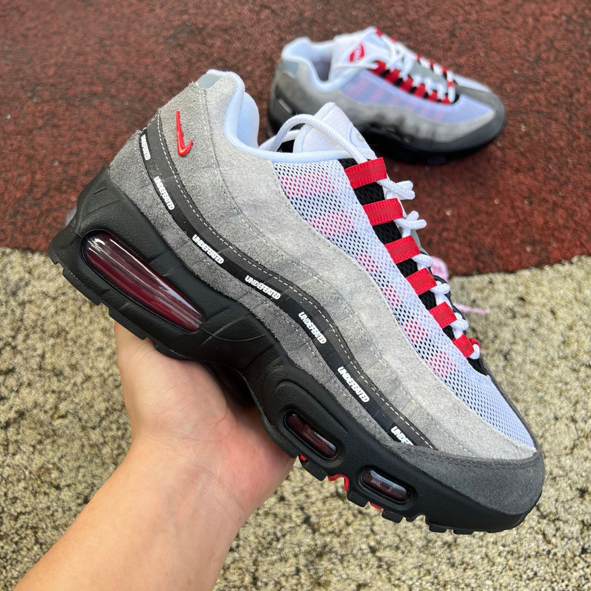 Nike Air Max 95 SP Undefeated Geo Tokyo sneakers in bright crimson with bold design details, featuring Nike x Jordan branding.