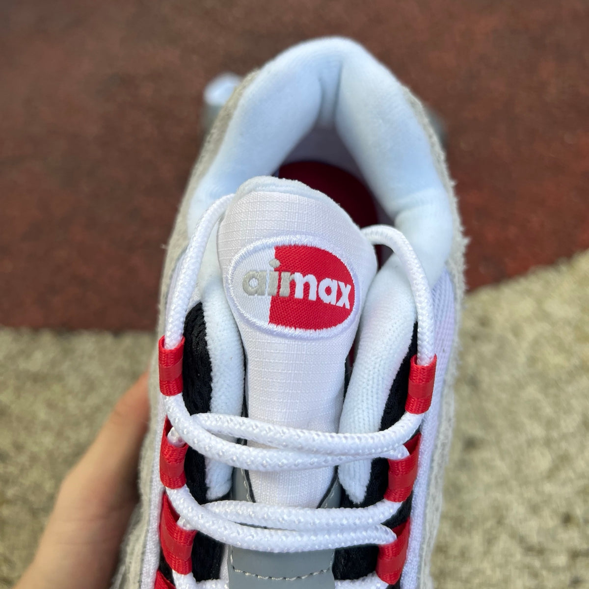 Nike Air Max 95 SP Undefeated Geo Tokyo sneakers in Bright Crimson with black and white accents, showcasing the detailed design.