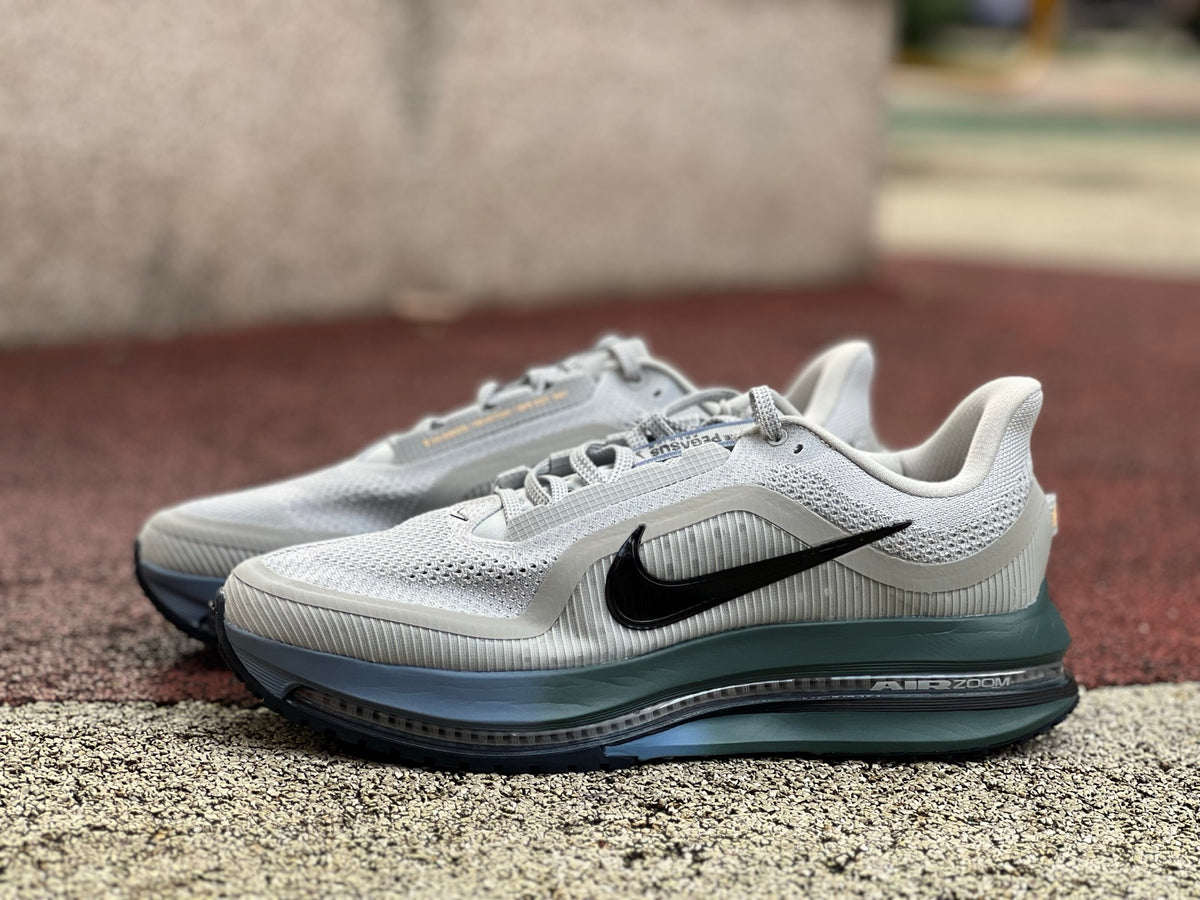 Nike Air Zoom Pegasus running shoes in grey mist, mineral slate, and dark obsidian, featuring Nike x Jordan branding.