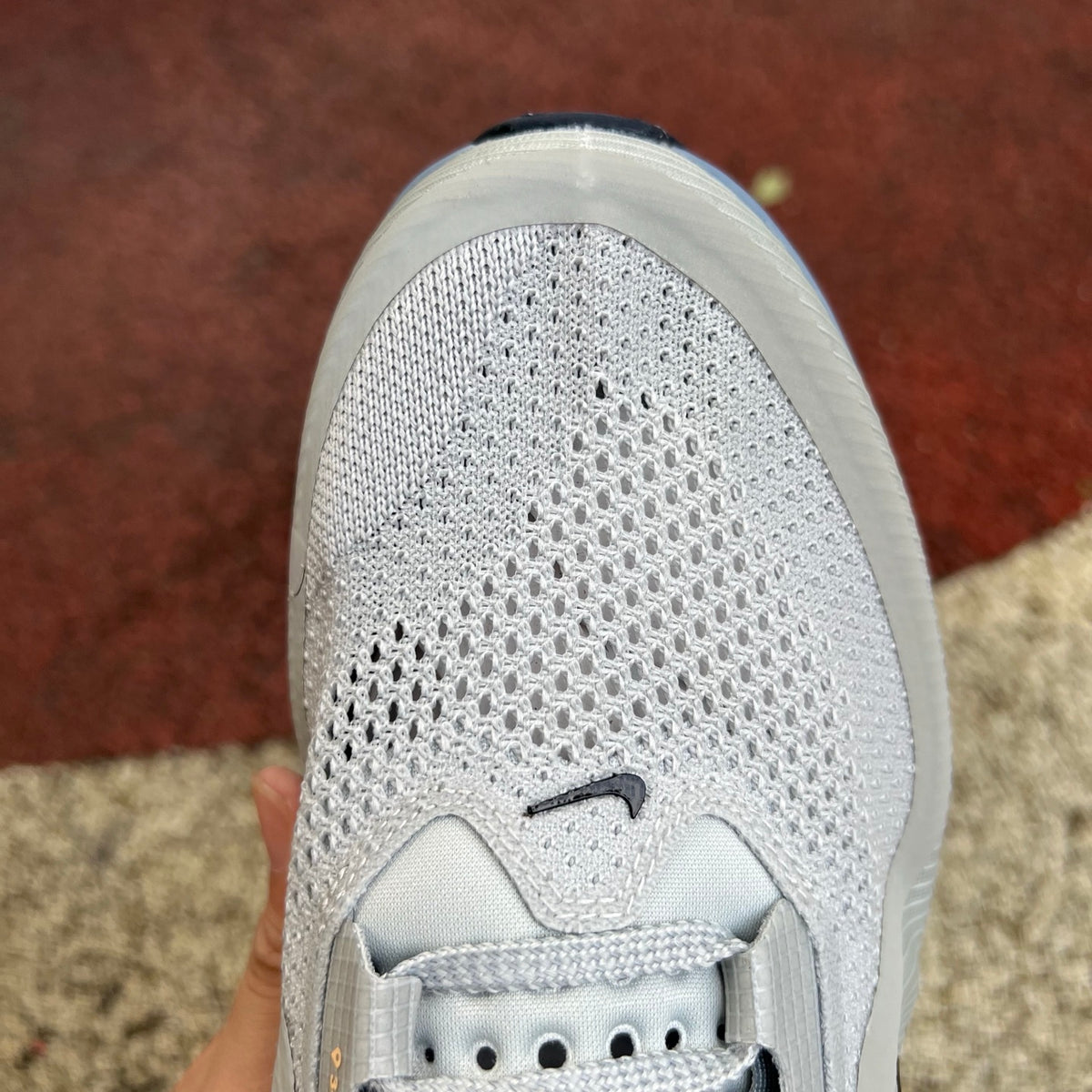Nike Air Zoom Pegasus running shoes in grey mist, mineral slate, and dark obsidian with Nike x Jordan branding, front view.