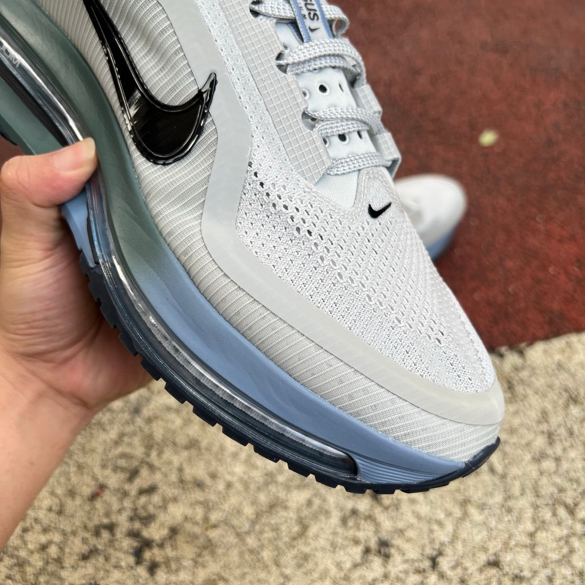 Nike Air Zoom Pegasus running shoes in grey mist, mineral slate, and dark obsidian with Nike x Jordan branding, front view.