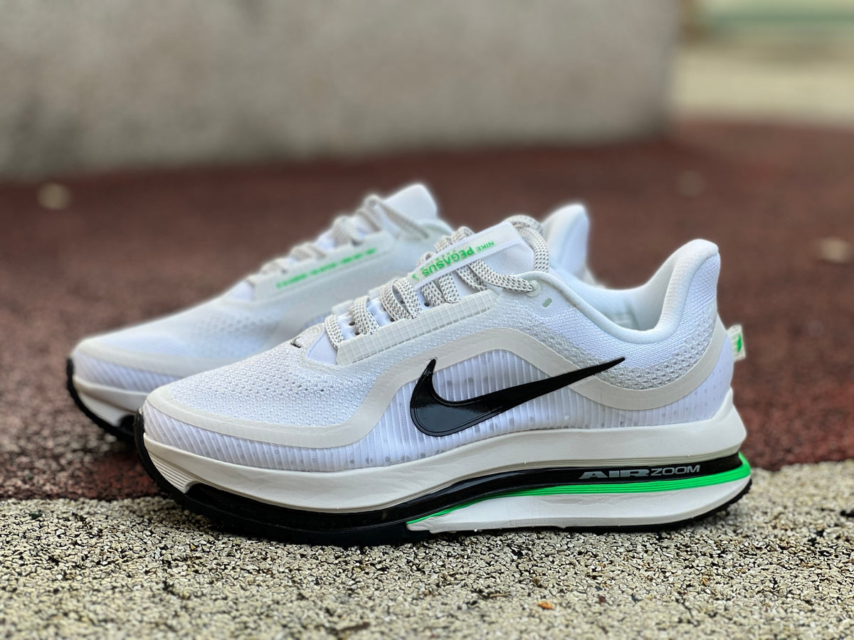 Nike Air Zoom Pegasus sneakers by Nike x Jordan in Seahawks colors, featuring a sleek design and athletic style.