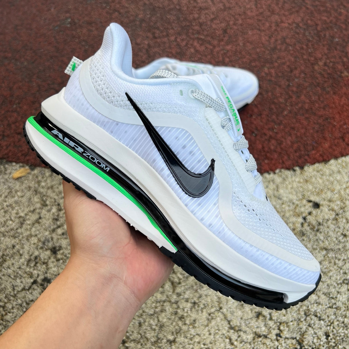 Nike Air Zoom Pegasus Premium running shoes with Seahawks design, featuring Nike x Jordan branding and blue accents.