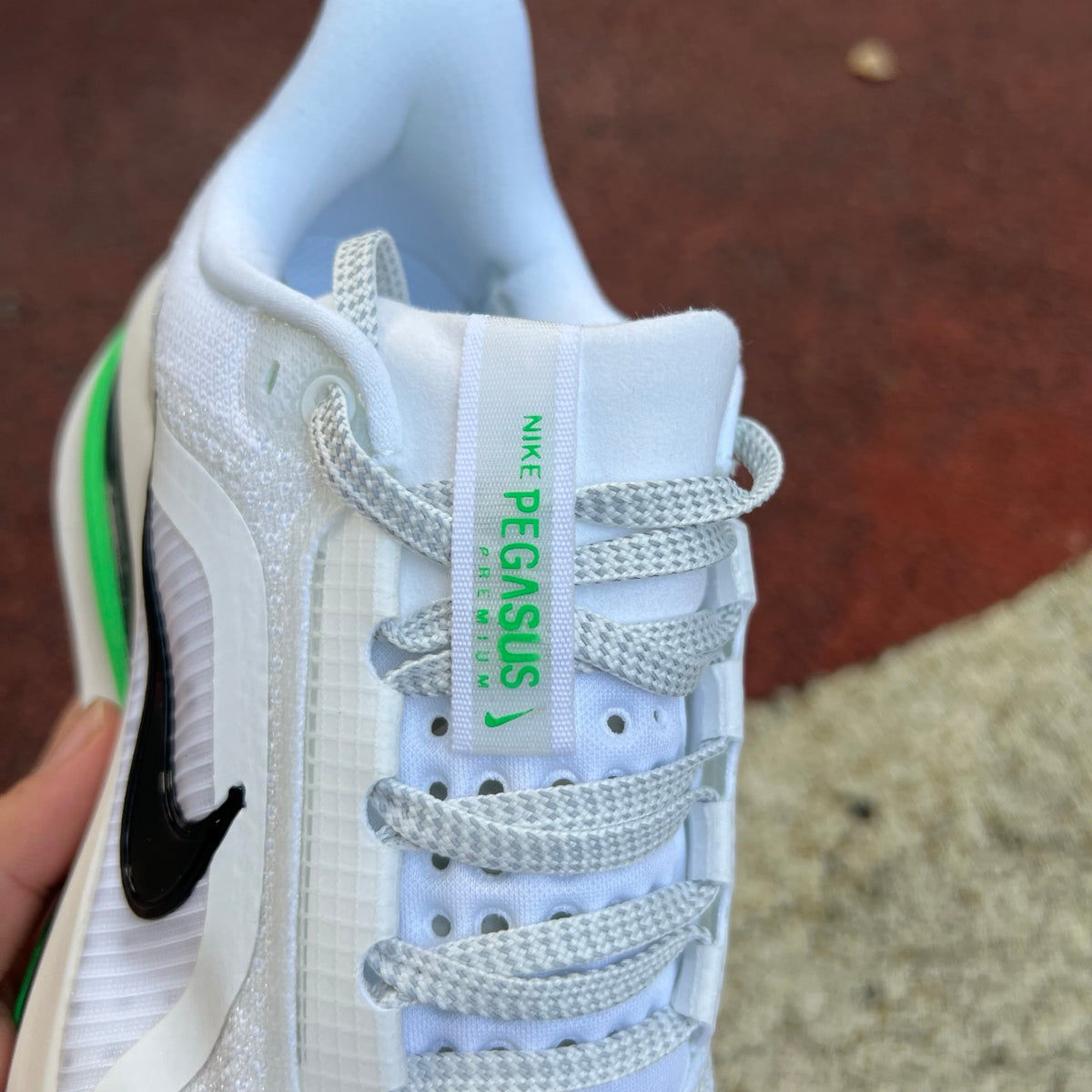 Nike Air Zoom Pegasus running shoes in Seahawks colorway, featuring Nike x Jordan branding and a sporty design.