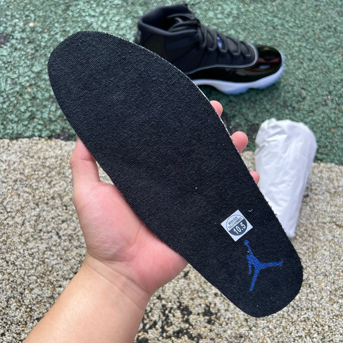 Nike Air Jordan 11 Retro Space Jam sneakers in black and blue with patent leather, featuring signature design elements.
