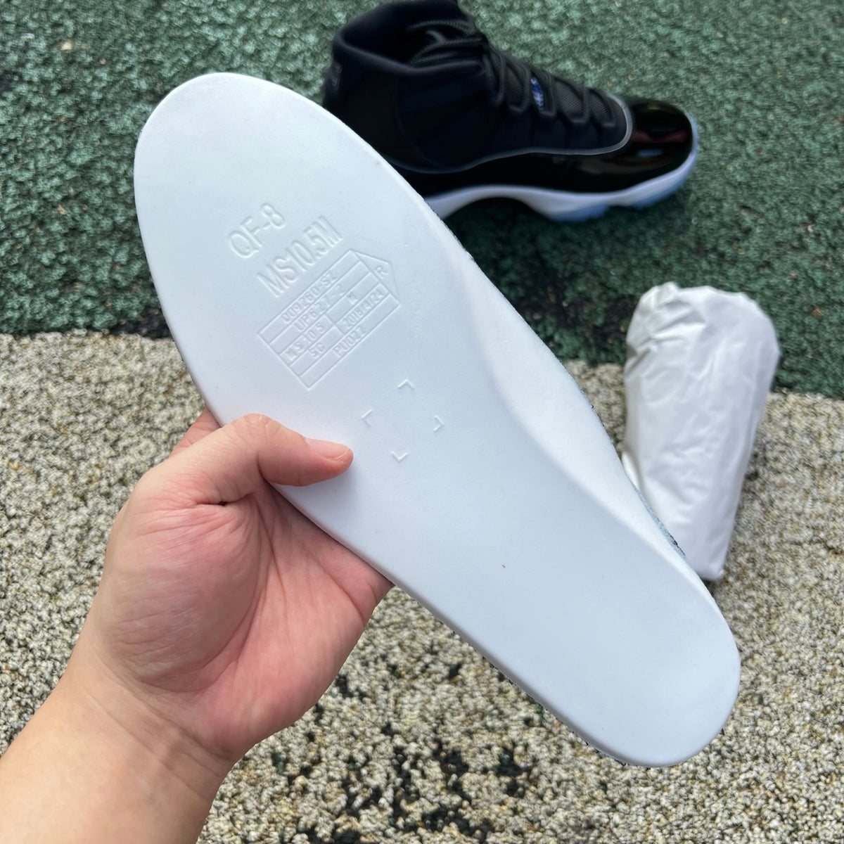 Nike Air Jordan 11 Retro Space Jam sneakers in black and blue with patent leather and Jumpman logo details.