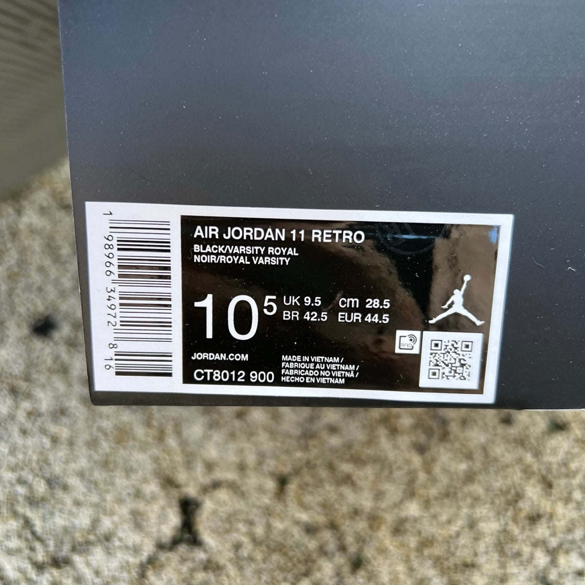 Nike Air Jordan 11 Retro Space Jam (2026) sneakers in black and blue with patent leather and Jumpman logo, displayed front view