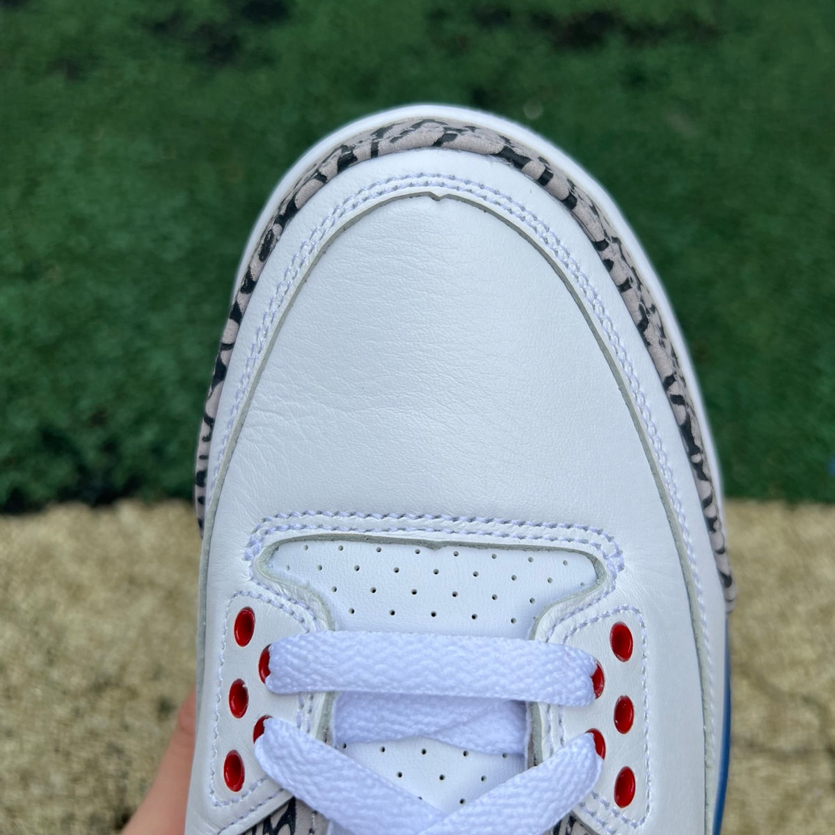 Nike Air Jordan 3 Retro True Blue sneakers in white and blue, showcasing the classic design and iconic branding.
