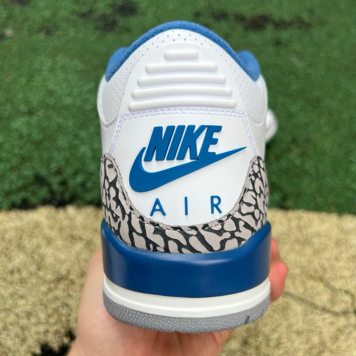 Nike Air Jordan 3 Retro True Blue sneakers in white, blue, and gray colorway with signature design details.