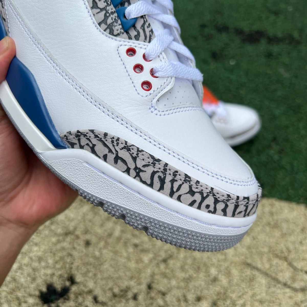 Nike Air Jordan 3 Retro True Blue sneakers in white, blue, and grey with signature design details and Nike Jordan branding.