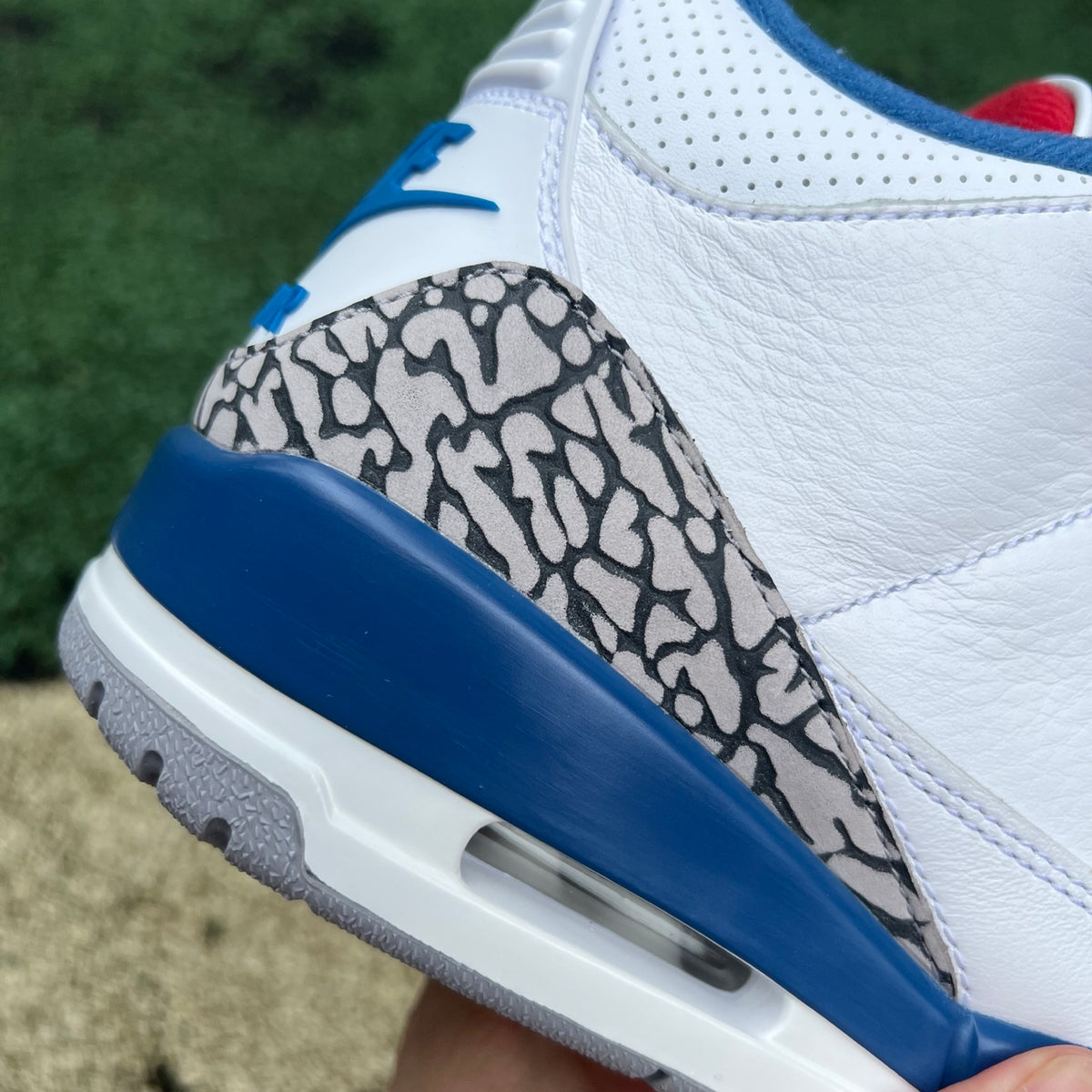 Nike Air Jordan 3 Retro True Blue sneakers in white and blue leather with grey accents, showcasing the iconic design.