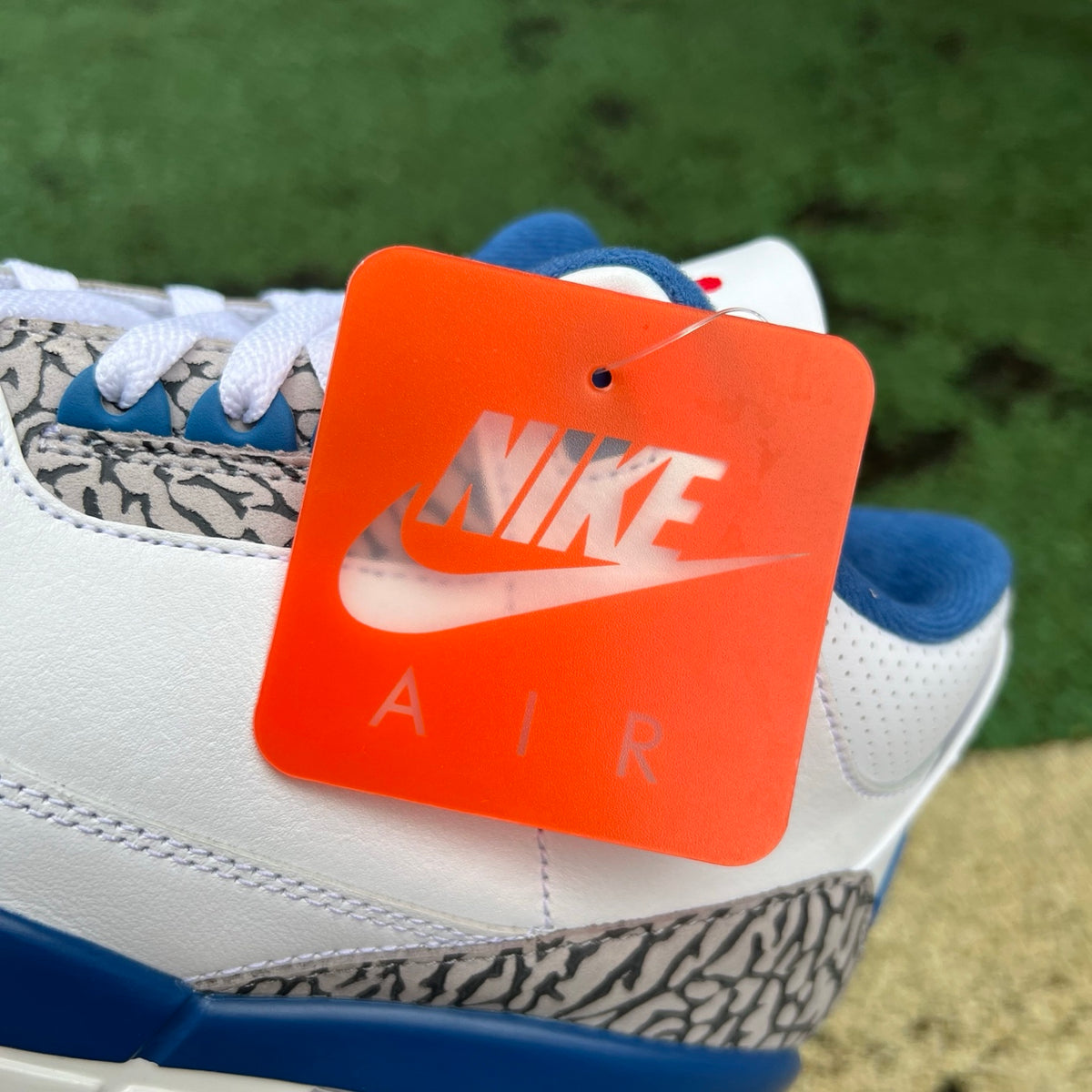 Nike Air Jordan 3 Retro True Blue sneakers featuring grey and blue leather with white accents and signature elephant print details.