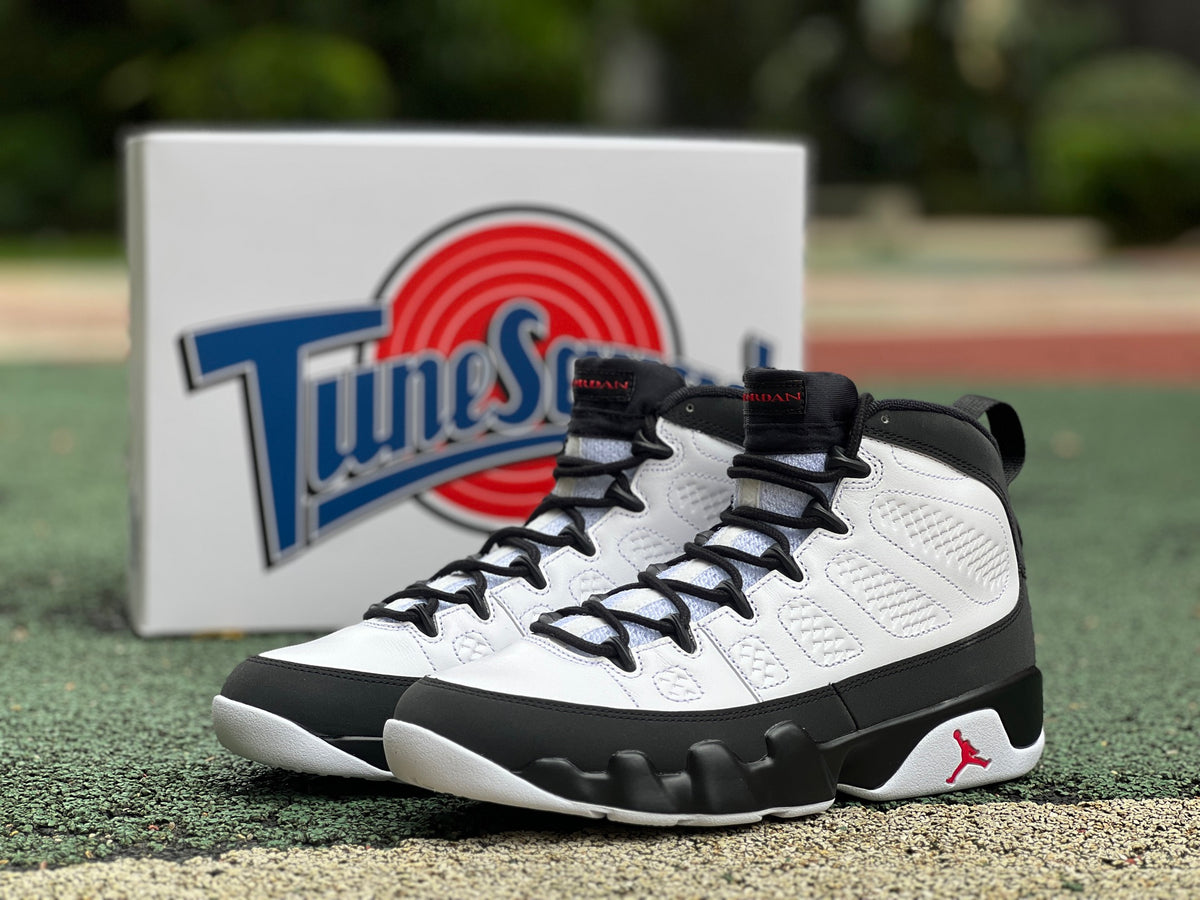 Nike Air Jordan 9 Retro OG Space Jam sneakers in black, white, and blue with signature details and Nike Jordan branding.