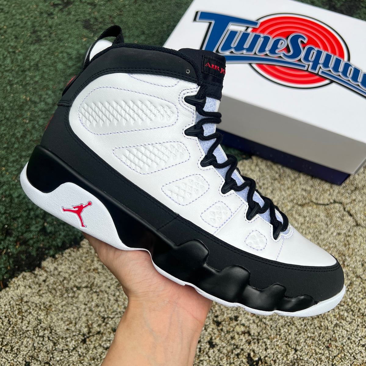Nike Air Jordan 9 Retro OG Space Jam sneakers in black and blue with white accents, showcasing the iconic basketball shoe design.