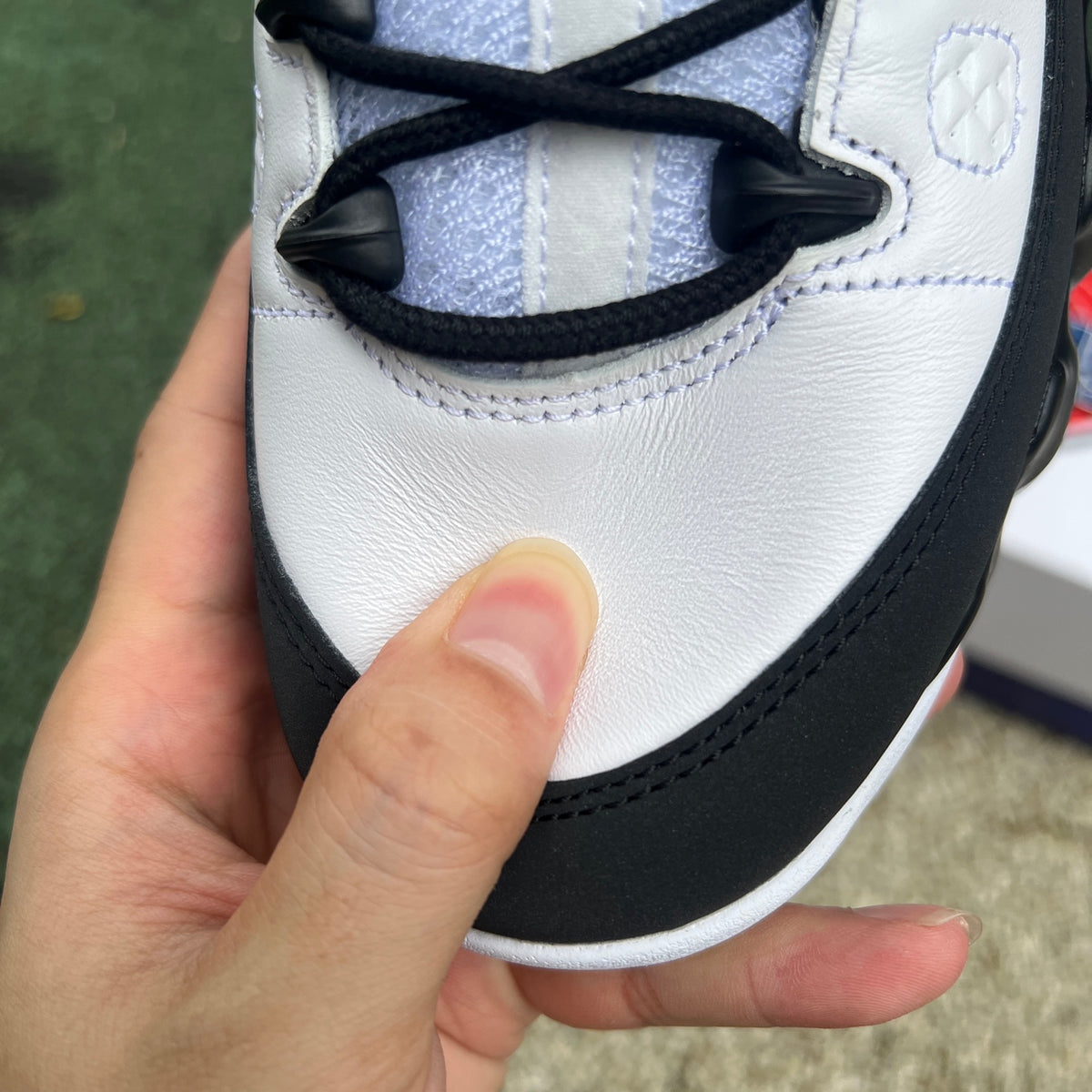 Nike Air Jordan 9 Retro OG Space Jam shoes in black and blue with white accents, showcasing the iconic design and branding.