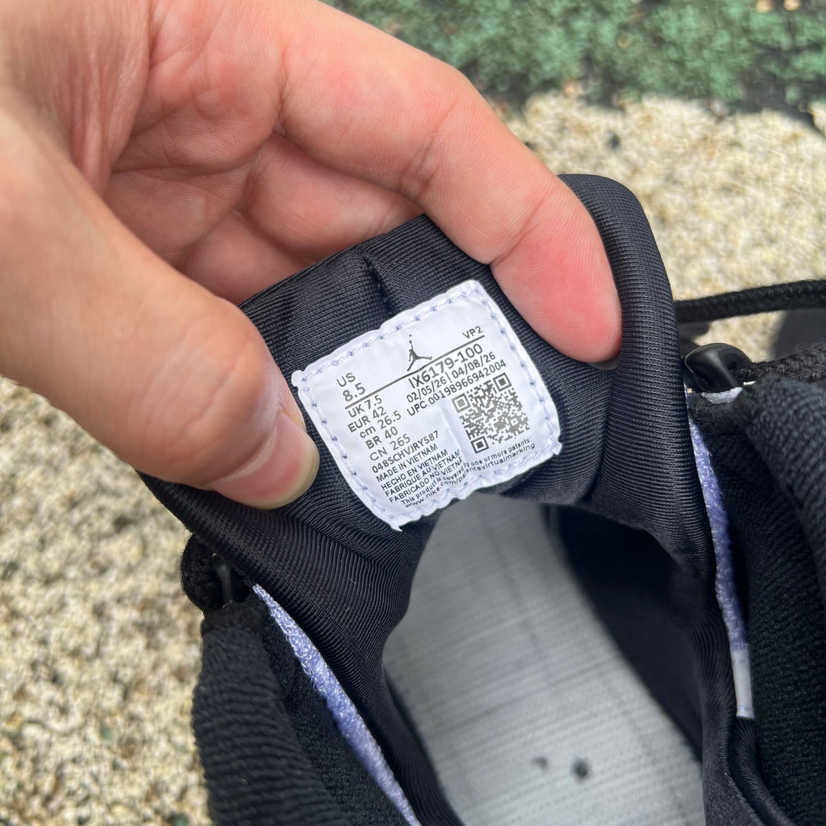Nike Air Jordan 9 Retro OG Space Jam sneakers in black and blue with Jumpman logo and space-themed design.