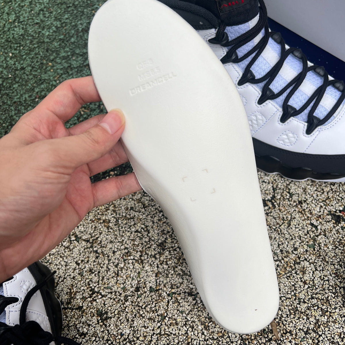 Nike Air Jordan 9 Retro OG Space Jam sneakers in white, black, and blue with Jumpman logo and retro design details.