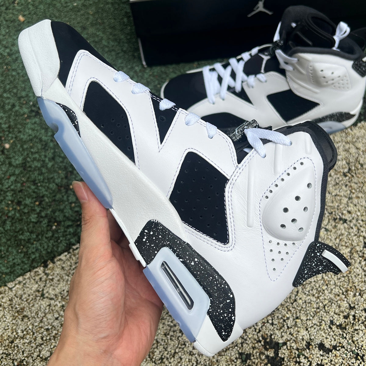 Nike Air Jordan 6 Retro Oreo sneakers in black and white with gray accents, featuring a sleek design and classic Jordan style.